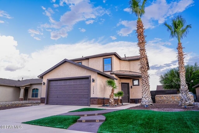 view of front property with a garage and a front lawn