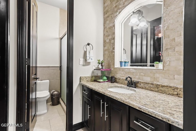 4500 Honey Willow Way, El Paso, TX 79922 - full bathroom with tile patterned flooring, toilet, vanity, and a stall shower