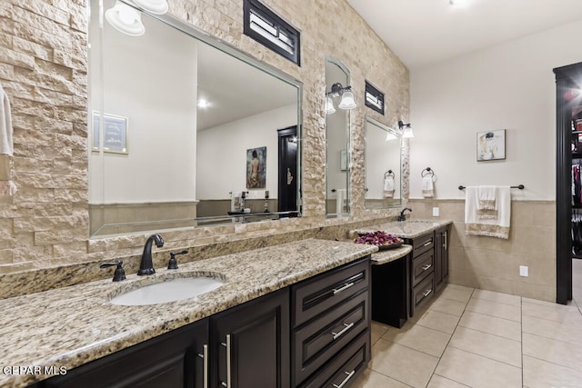 bathroom featuring vanity, tile walls, and tile patterned floors