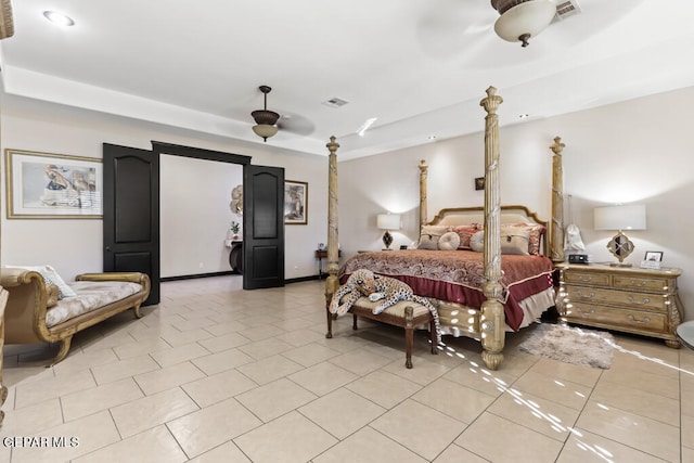 tiled bedroom with ceiling fan