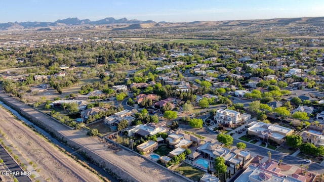 birds eye view of property with a mountain view