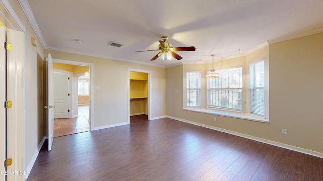 unfurnished room featuring ceiling fan with notable chandelier, dark hardwood / wood-style flooring, and ornamental molding