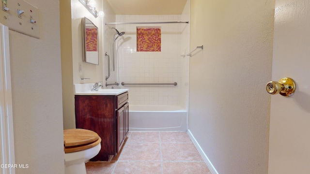 full bathroom with tile patterned floors, vanity, toilet, and tiled shower / bath combo