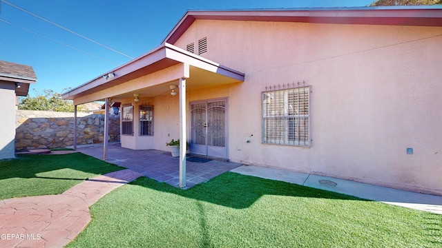 exterior space featuring a yard and a patio