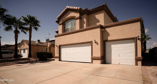 view of front of home with a garage