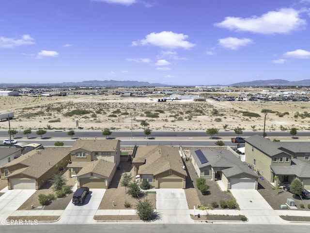 birds eye view of property with a residential view and a mountain view