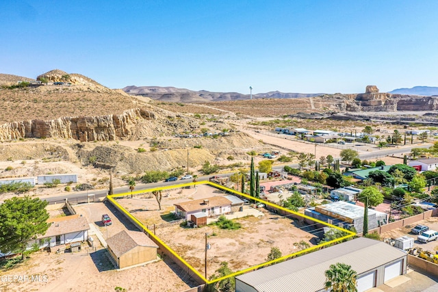 birds eye view of property featuring a mountain view