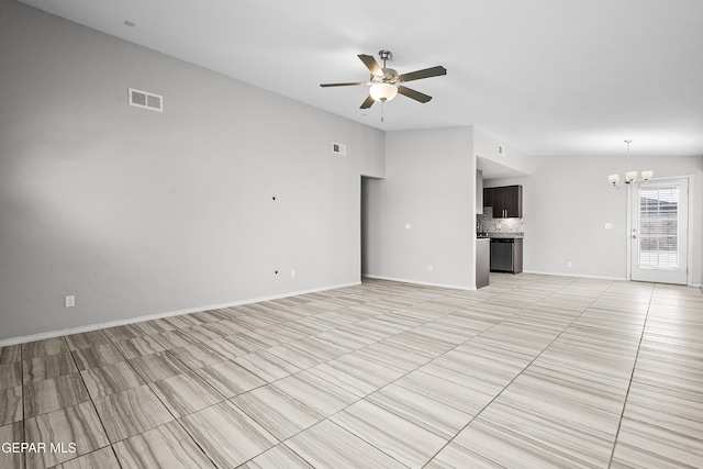 unfurnished living room featuring lofted ceiling, ceiling fan with notable chandelier, visible vents, and baseboards