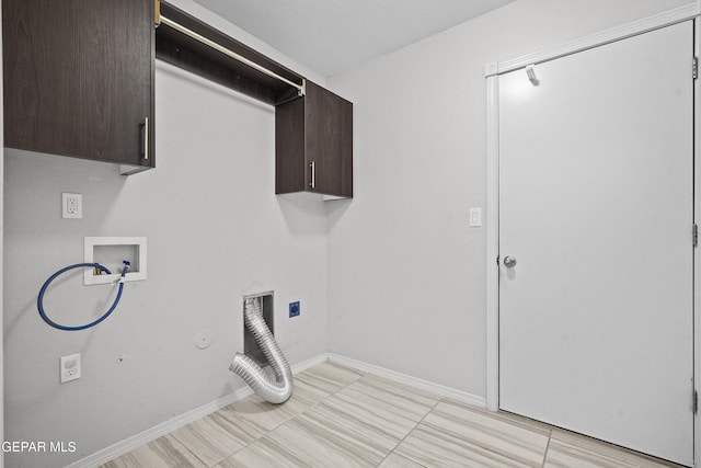 laundry area featuring baseboards, hookup for a washing machine, hookup for a gas dryer, cabinet space, and electric dryer hookup