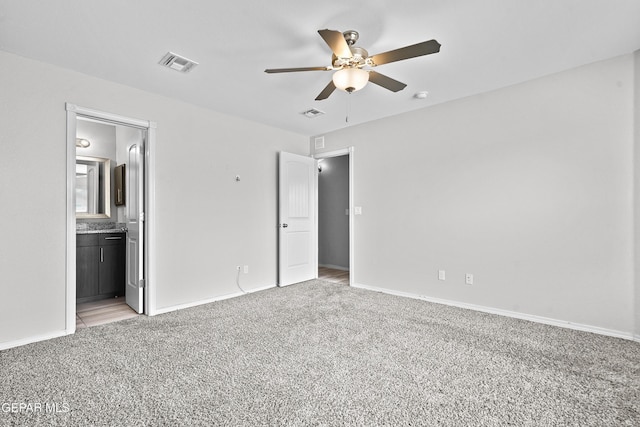 unfurnished bedroom with light colored carpet, visible vents, and baseboards