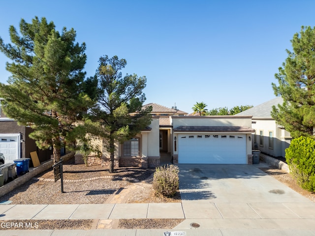 obstructed view of property featuring a garage