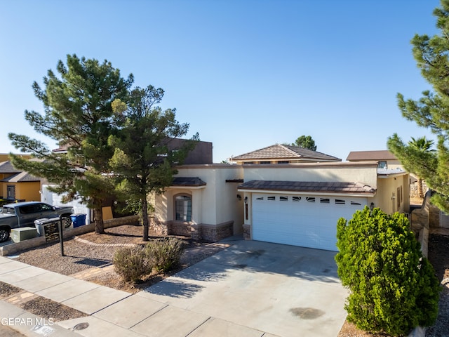 view of front of property with a garage