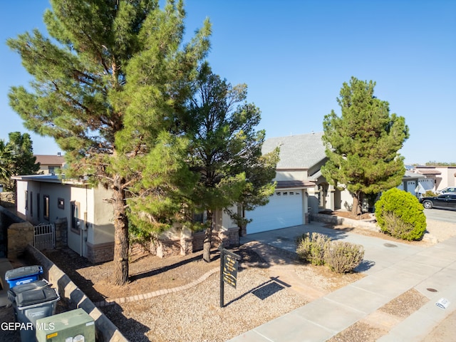 obstructed view of property with a garage