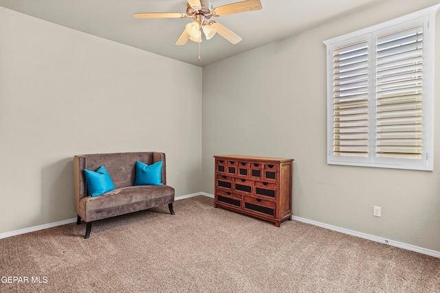 sitting room with light colored carpet and ceiling fan