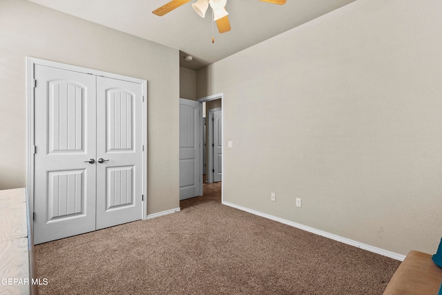 unfurnished bedroom with carpet flooring, a closet, and ceiling fan