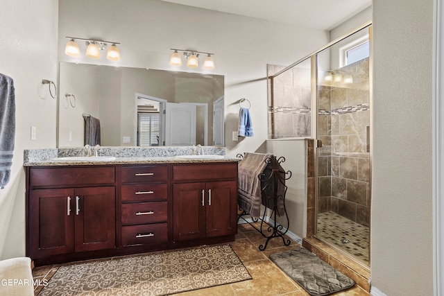 bathroom featuring vanity, walk in shower, and tile patterned flooring