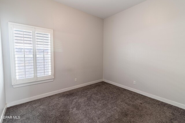 carpeted empty room with a wealth of natural light