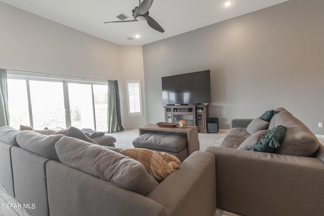 living area with visible vents, recessed lighting, baseboards, and a ceiling fan