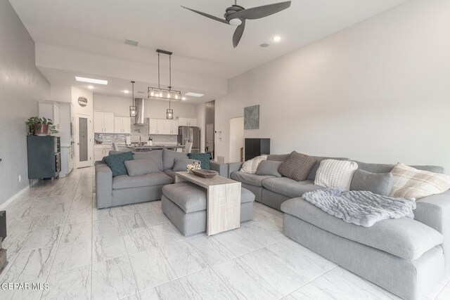 living room with ceiling fan