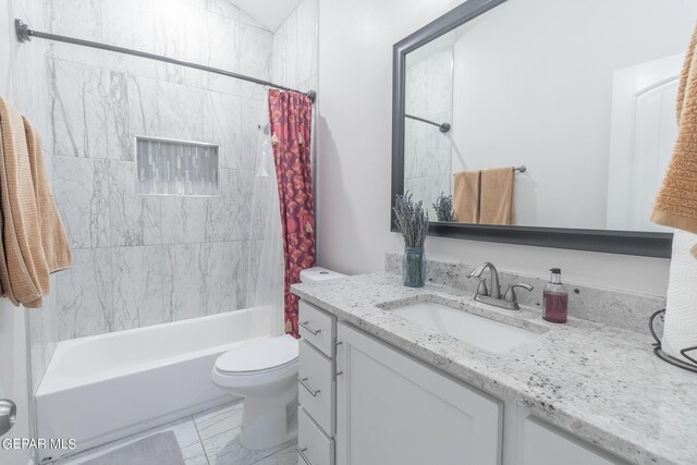 full bathroom featuring vanity, toilet, and shower / bath combo with shower curtain