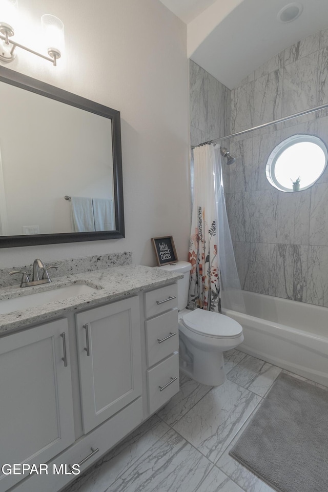full bathroom featuring vanity, toilet, shower / bath combo, and marble finish floor