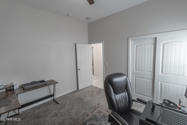 home office featuring light colored carpet and ceiling fan