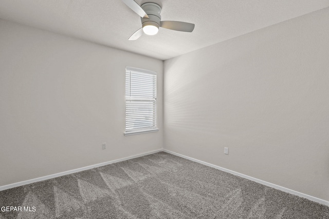 unfurnished room featuring ceiling fan and carpet