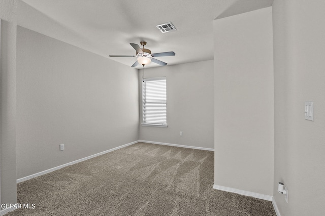 carpeted empty room featuring ceiling fan