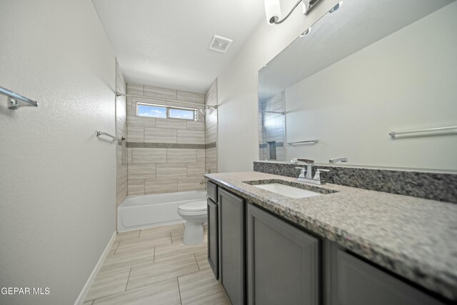 full bath with vanity, baseboards, visible vents, tub / shower combination, and toilet