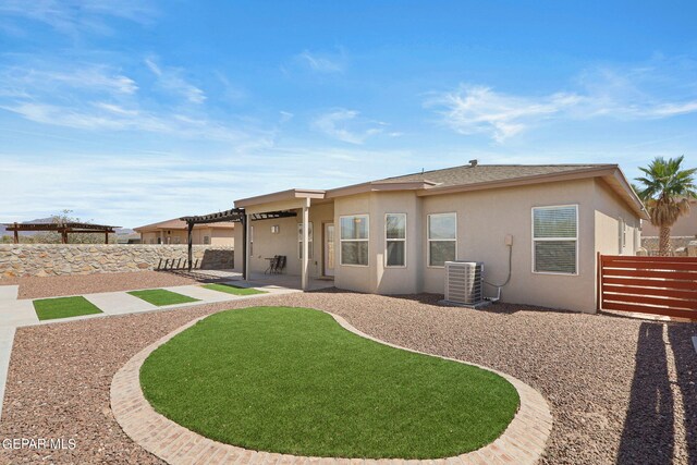 rear view of house with cooling unit and a patio