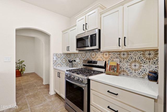 kitchen featuring backsplash and stainless steel appliances