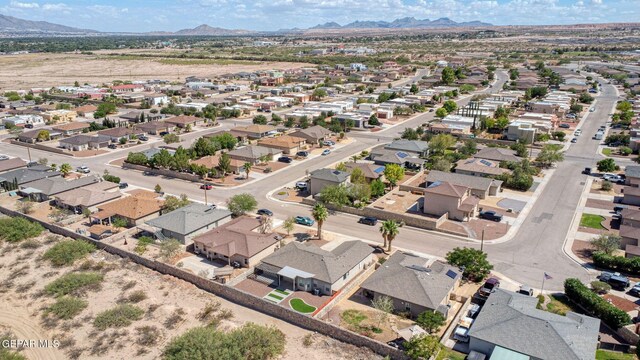 birds eye view of property with a mountain view