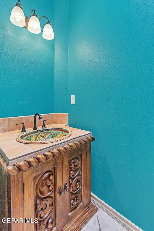 bathroom featuring tile patterned flooring and sink