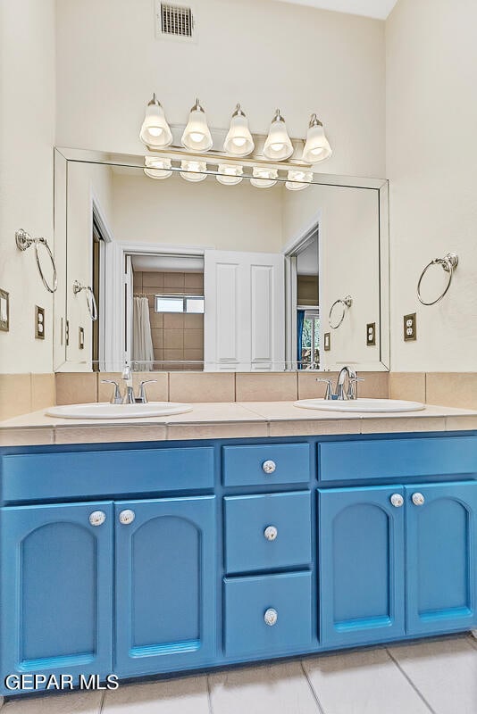 bathroom featuring vanity and tile patterned flooring