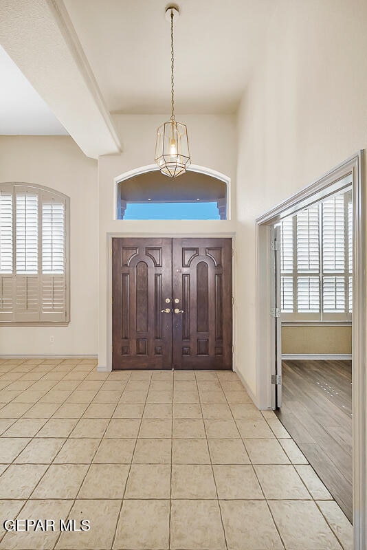 foyer featuring light tile patterned floors