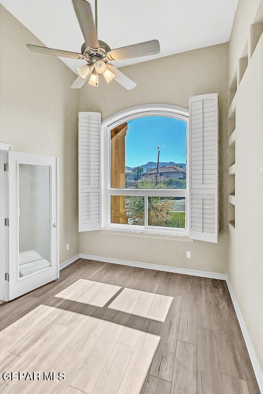 interior space with light hardwood / wood-style flooring and ceiling fan