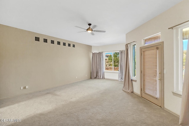 carpeted empty room with ceiling fan