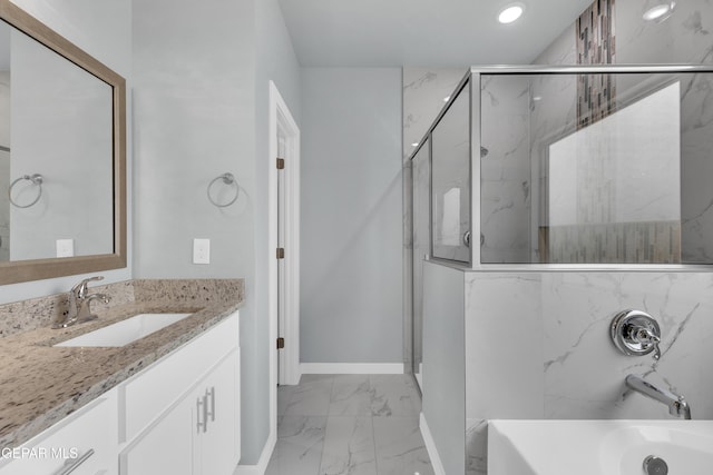 bathroom with vanity and separate shower and tub