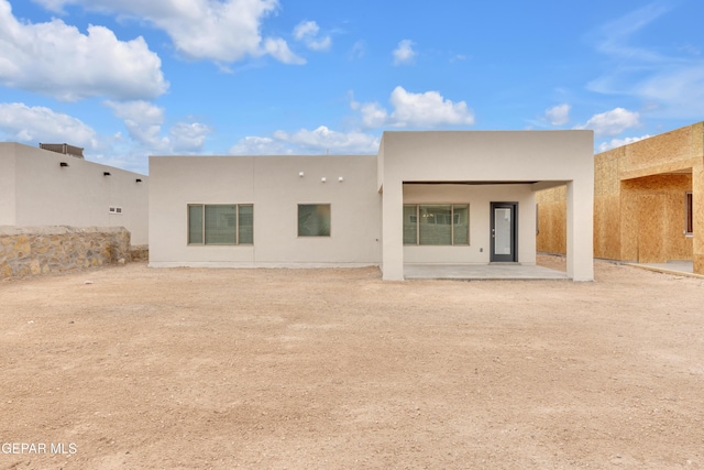 rear view of house featuring a patio