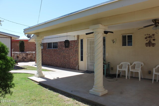 view of patio featuring ceiling fan