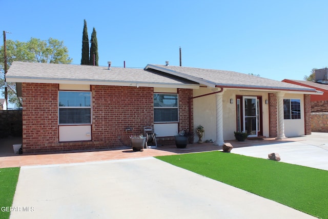 ranch-style home with a patio area