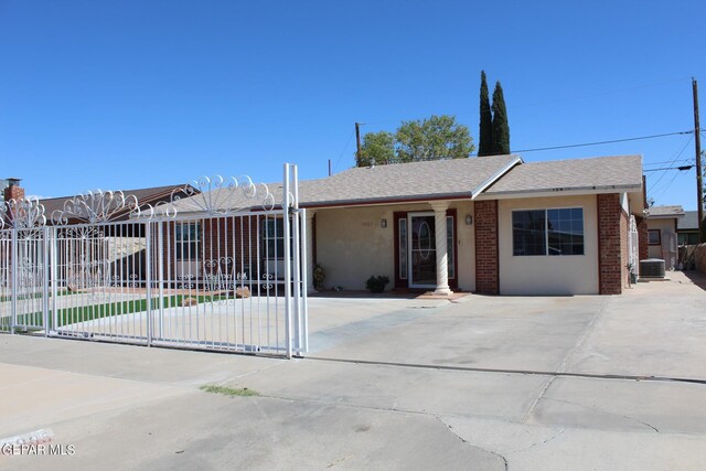 single story home featuring central air condition unit