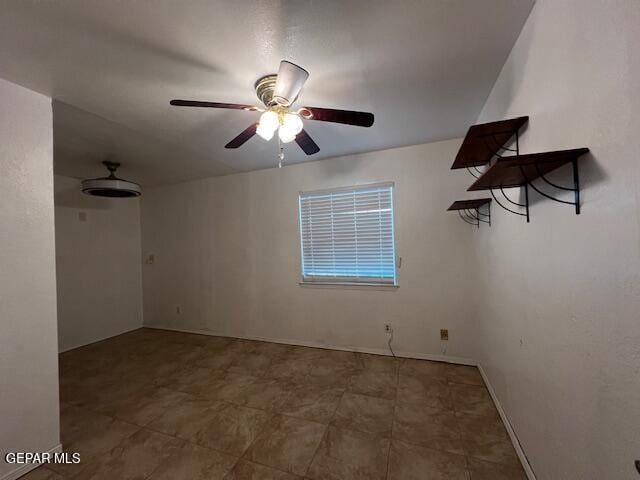 spare room with ceiling fan