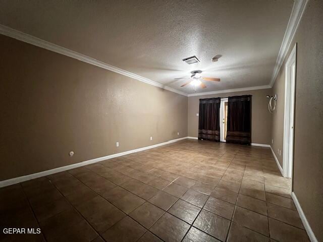 tiled empty room featuring a textured ceiling, ornamental molding, and ceiling fan