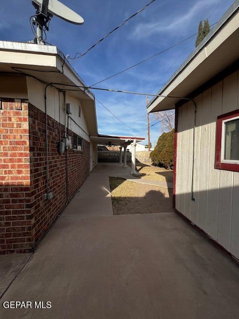 view of side of home featuring a patio area