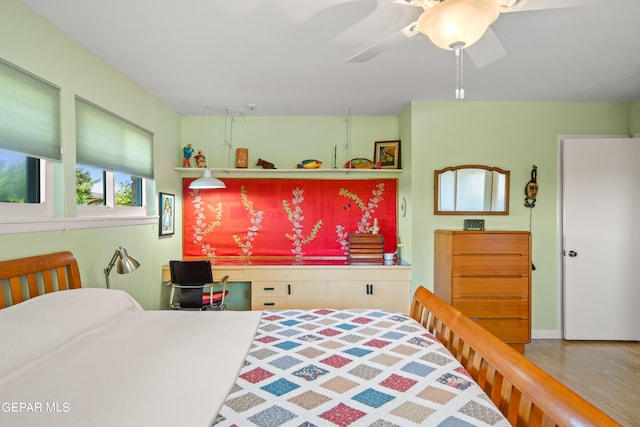 bedroom featuring ceiling fan and hardwood / wood-style floors