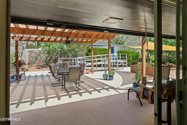 view of patio / terrace with a pergola and ceiling fan