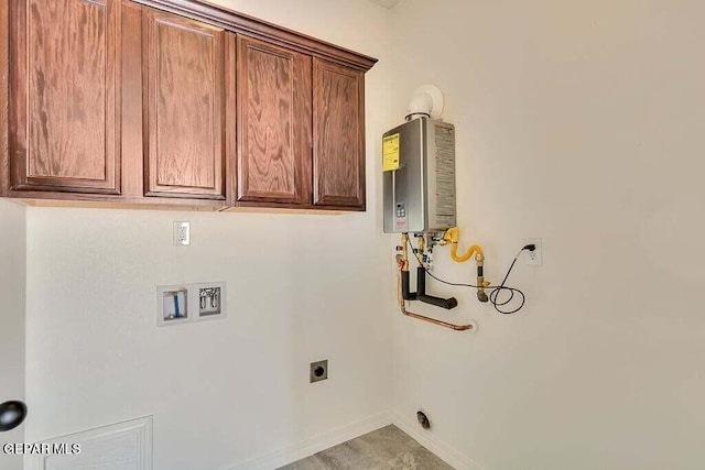 washroom with hookup for a washing machine, cabinets, water heater, and hookup for an electric dryer