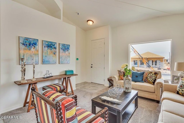 living room featuring lofted ceiling and carpet