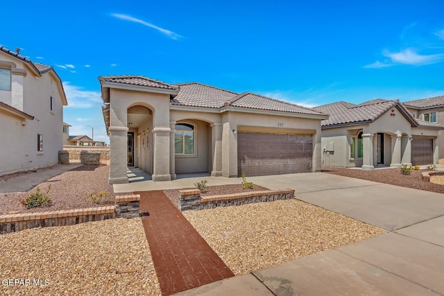 mediterranean / spanish-style house featuring a garage